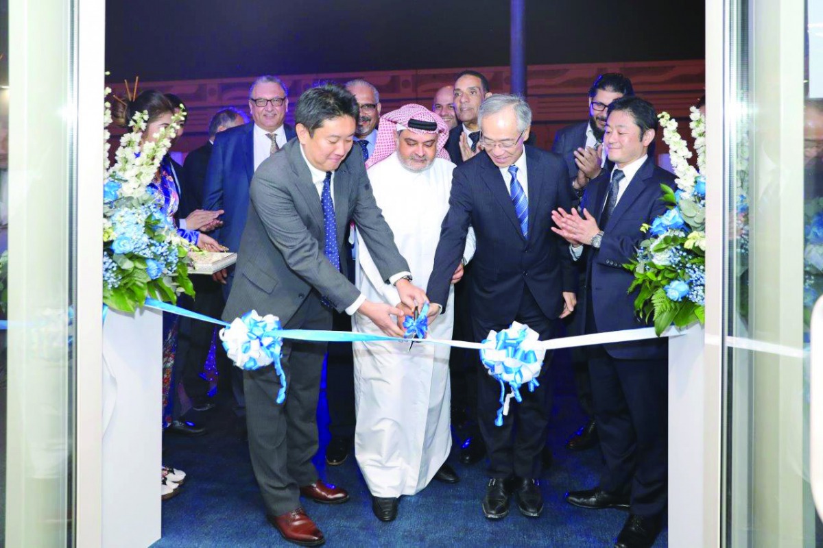 Japanese Ambassador to Qatar, Kazuo Sunaga, cutting the ribbon with Khalid Mannai (centre), Vice-Chairman of the Executive Committee, Mannai Corporation, and Senior Subaru Corporation Executives, to mark the opening of the new Subaru car showroom, recentl