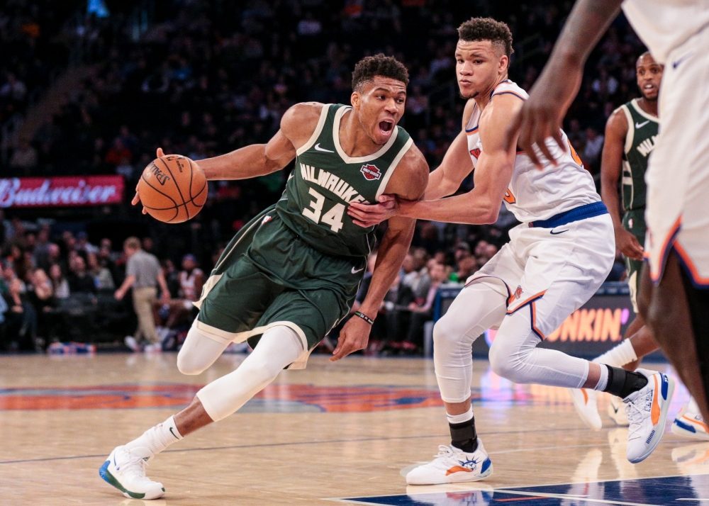 Milwaukee Bucks forward Giannis Antetokounmpo (34) drives the ball to the basket as New York Knicks forward Kevin Knox II (20) defends during the second half at Madison Square Garden.  Vincent Carchietta