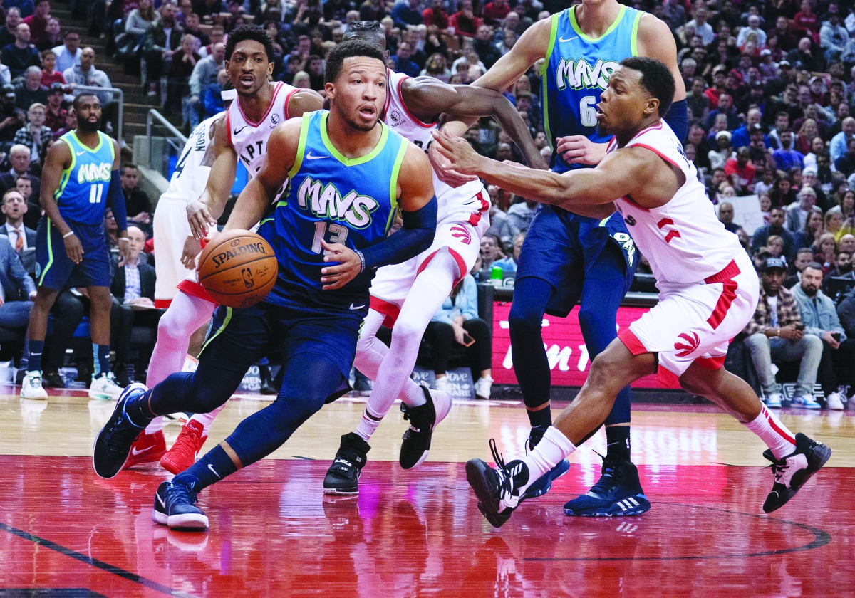 
Dallas Mavericks guard Jalen Brunson (13) controls a ball as Toronto Raptors guard Kyle Lowry (7) defends during the fourth quarter at Scotiabank Arena, Dec 22, 2019, Toronto. Credit: Nick Turchiaro-USA TODAY Sports