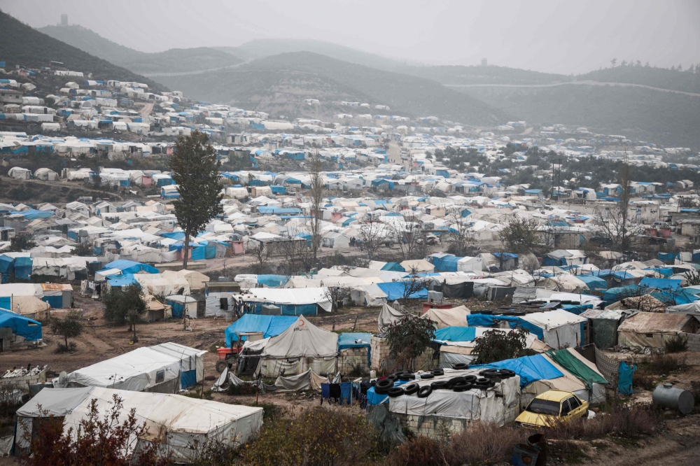 FILE PHOTO: A view of tents at a camp for displaced Syrians at Khirbet al-Joz in the west of the northwestern Idlib province near the border with Turkey, where residents survive mostly on aid and barely have enough money to buy food and clothes to keep wa