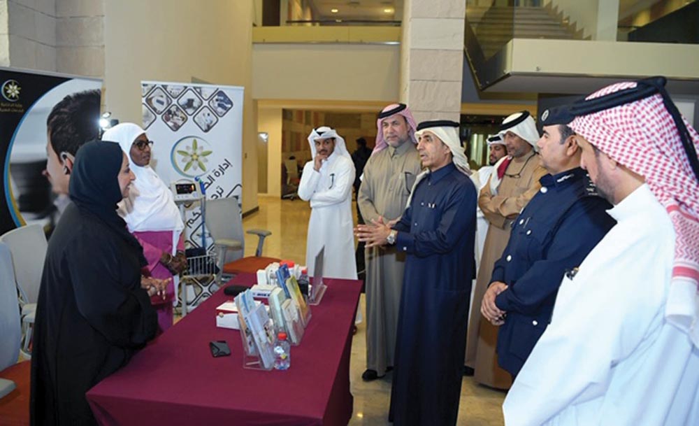 Dr. Ibrahim Saleh Al Nuaimi, Undersecretary of the Ministry of Education and Higher Education, and Brigadier Mohamed Abdullah Al Shahwani, at the exhibition organised by MoI to train people with disabilities. 