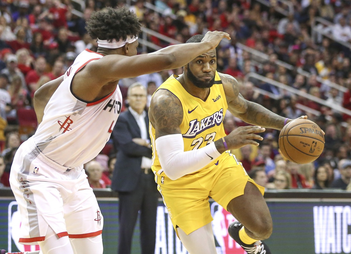 Los Angeles Lakers forward LeBron James (23) drives with the ball as Houston Rockets forward Danuel House Jr. (4) defends during the fourth quarter at Toyota Center. Credit: Troy Taormina-USA TODAY Sports
