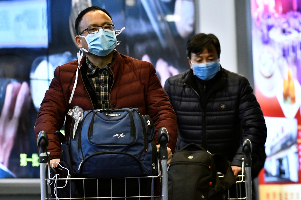 Travellers at Vancouver International Airport in Richmond, British Columbia, Canada January 24, 2020. Reuters/Jennifer Gauthier