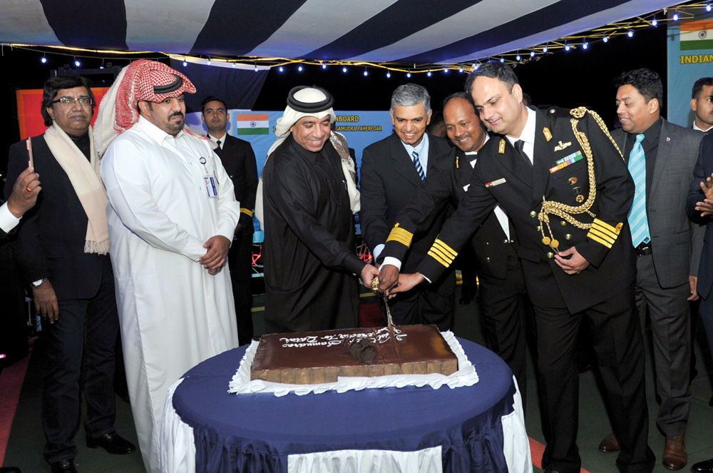 Ambassador of India to Qatar, H E P. Kumaran, and Commanding Officer of ICGS Samudra Paheredar, DIG Anwar Khan, with Qatari officials cutting a cake to mark the visit of the ship to Qatar. Pic: Salim Matramkot/The Peninsula