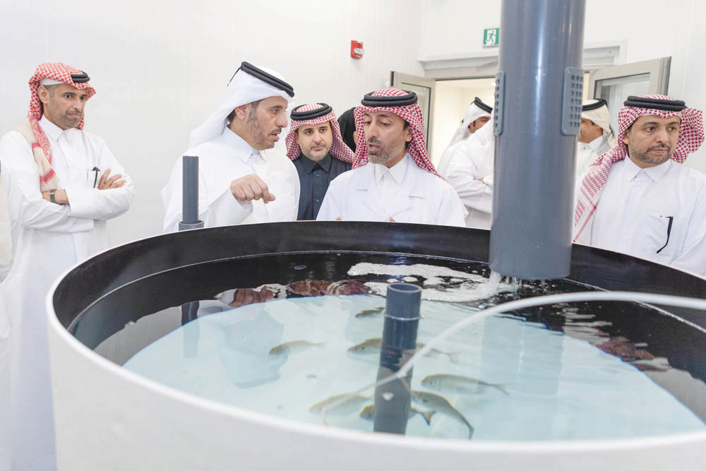 Prime Minister and Interior Minister, H E Sheikh Abdullah bin Nasser bin Khalifa Al Thani, being briefed on the tasks of Aquatic Research Centre, yesterday.