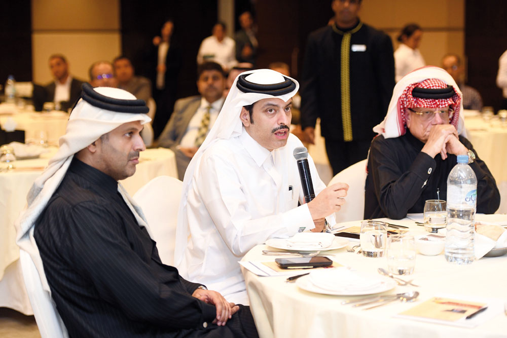 Officials participate in a discussion on social responsibility during a lecture held yesterday.