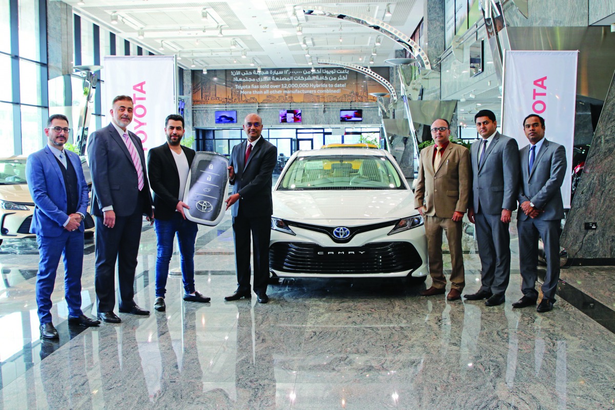 R K Murugan (fourth left), Acting CEO at AAB, handing over the symbolic Toyota key to Nezar Al Merai (third left), General Manager of Global Limousine, at a ceremony in Doha, recently. 