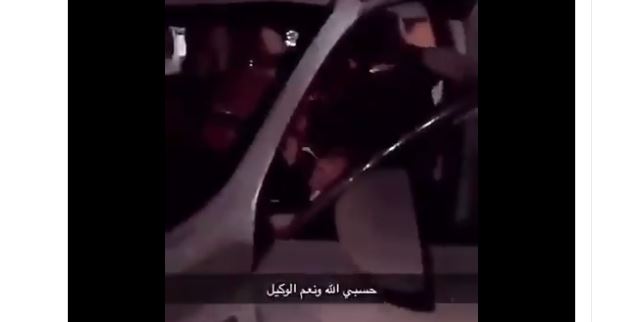 One person was seen abusing and aggressively trying to pull the driver, who was apparently tied to the seat by seat belt, out of the car. (From a Twitter video) 