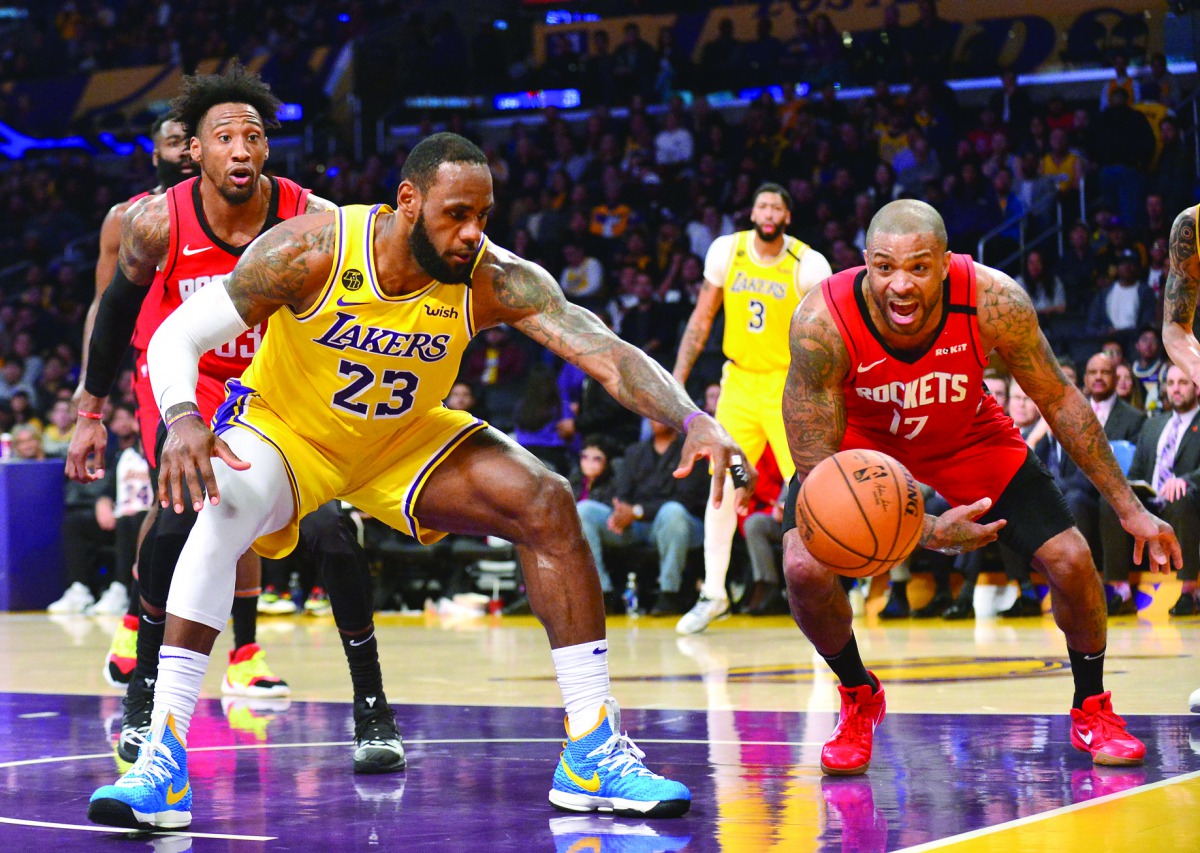 Los Angeles Lakers forward LeBron James (23) plays for the ball against Houston Rockets forward P.J. Tucker (17) during the second half at Staples Center. Mandatory Credit: Gary A. Vasquez-USA TODAY Sports
