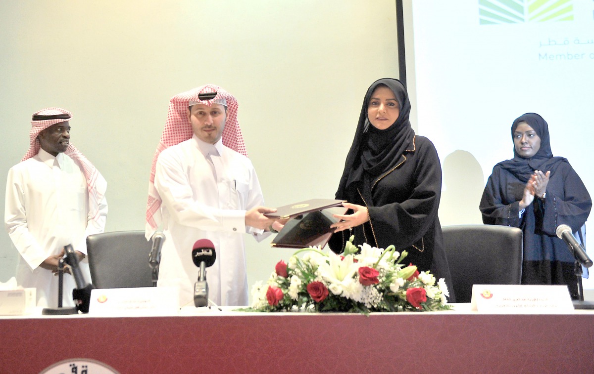 The Director of Qatar Green Building Council, Eng. Meshal Al Shamari, and Assistant Undersecretary for Educational Affairs at the Ministry of Education and Higher Education, Fawzia Al Khater, during the signing of an MoU at the Ministry, yesterday. Pic: B