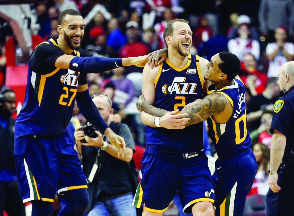 Utah Jazz guard Joe Ingles (2) celebrates with center Rudy Gobert (27) and guard Jordan Clarkson (00) after the Jazz defeated the Houston Rockets at Toyota Center. Credit: Troy Taormina-USA TODAY Sports