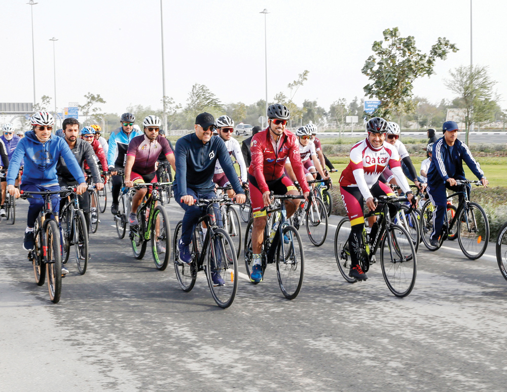 Prime Minister and Minister of Interior, H E Sheikh Khalid bin Khalifa bin Abdulaziz Al Thani joins others on cycling trip during the opening of the track yesterday.