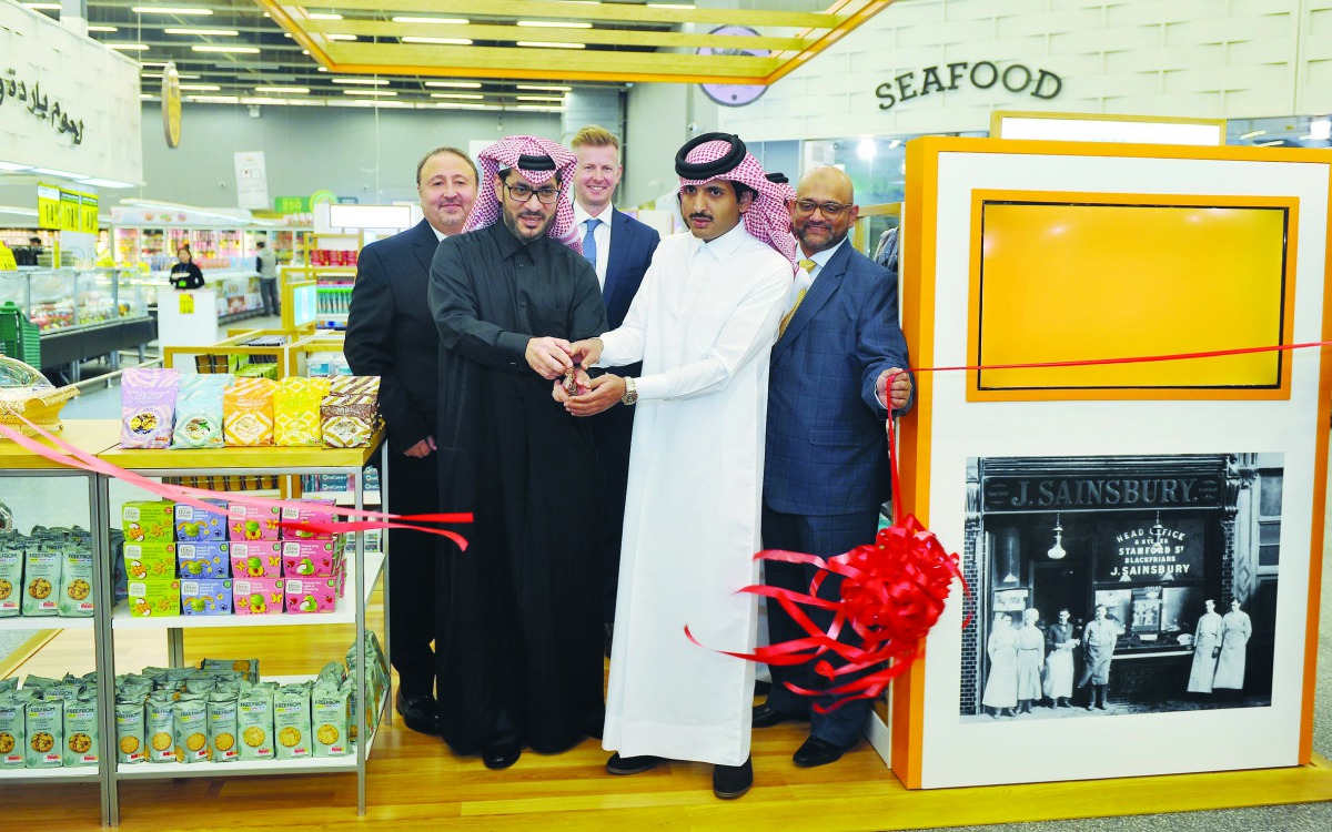 Sheikh Suhaim bin Khalid Al Thani, Chairman of Marakez Holding, and Youssef Ali Al Obaidan, CEO of Al Meera, cutting a ribbon with other officials during the launch of Sainsbury’s store at Al Meera at Hyatt Plaza Mall on Wednesday. Pic: Abdul Basit/The Pe