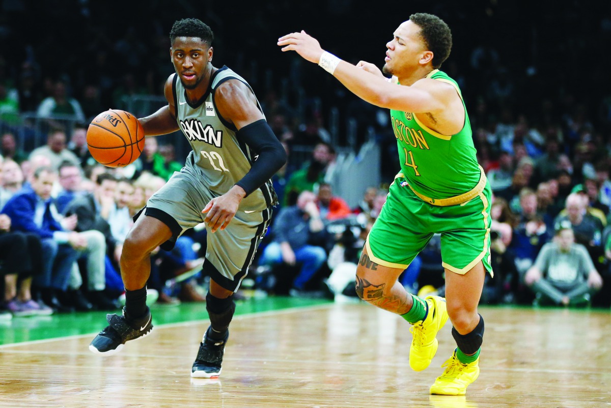 Brooklyn Nets guard Caris LeVert (22) drives against Boston Celtics point guard Carsen Edwards (4) during overtime at TD Garden. Credit: Greg M. Cooper-USA TODAY Sports