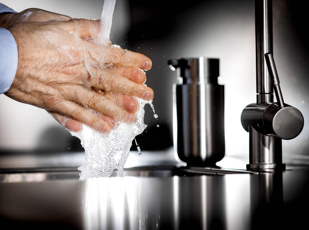 An illustraton picture shows a person washing their hands with disinfectant soap. (AFP / ANP / Koen Van WEEL)