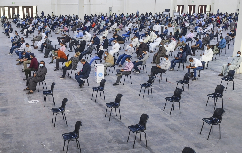 Kuwait - MARCH 12: People wait at the fairground which has become a health center for coronavirus testing in kuwait City on March 12, 2020. T. ( Jaber Abdulkhaleg - Anadolu Agency )
