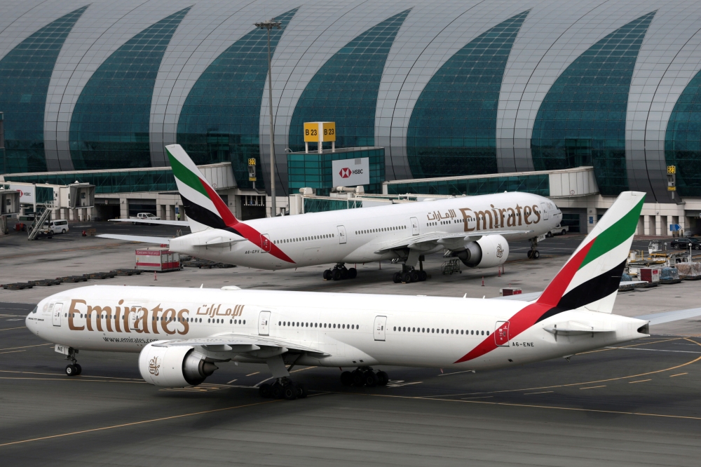 FILE PHOTO: Emirates Boeing 777-300ER planes at Dubai International Airport in Dubai, United Arab Emirates, February 15, 2019. REUTERS/Christopher Pike