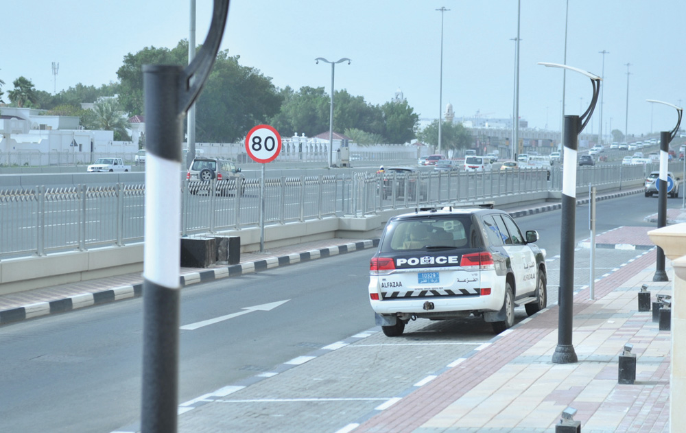 Police patrolling Doha Expressway after the latest instructions from the Supreme Committee for Crisis Management, yesterday.  Pic: Baher Amin/The Peninsula