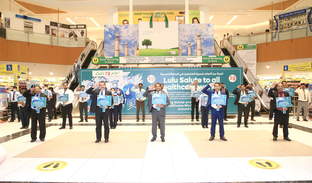 The officials and staff of Lulu Hypermarket salute healthcare workers engaged in the fight against COVID-19, at its D-Ring Road branch.
