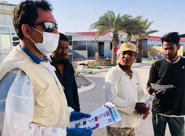 Ramesh Bhata, a leader of Nepalese expatriate community, distributing awareness leaflets in Nepali language among workers in coordination with Qatar Charity.