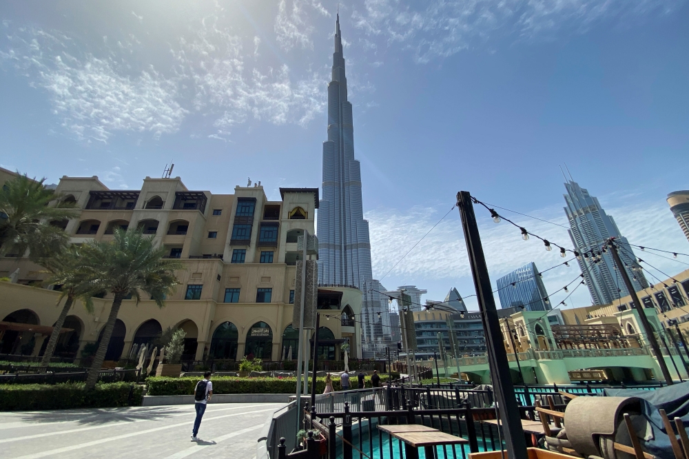 People walk outside Dubai mall after the UAE government eased a curfew and allowed stores to open, following the outbreak of the coronavirus disease (COVID-19) in Dubai, United Arab Emirates May 3, 2020. REUTERS/Abdel Hadi Ramahi