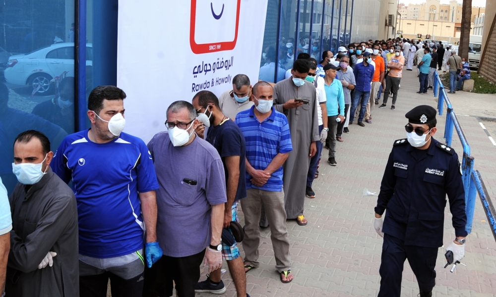 Citizens queue in front of markets in Kuwait City, Kuwait on May 9, 2020. Kuwait extended the curfew to May 30 as part of efforts to battle the novel coronavirus (Covid-19) pandemic. Faisal Yaser - Anadolu