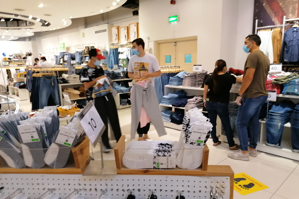 Customers shop at an outlet in City Center, as commercial centres reopened with limited capacity yesterday. 
Pic: Salim Matramkot/ThePeninsula   