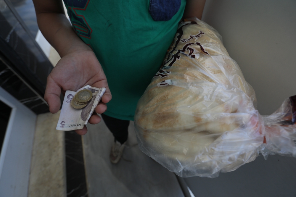 People living in Syria's northwest, begin to use Turkish lira to maintain their purchasing power amid steep fall in value of Syrian pound against US dollar, on June 14, 2020.Bekir Kas?m - Anadolu 