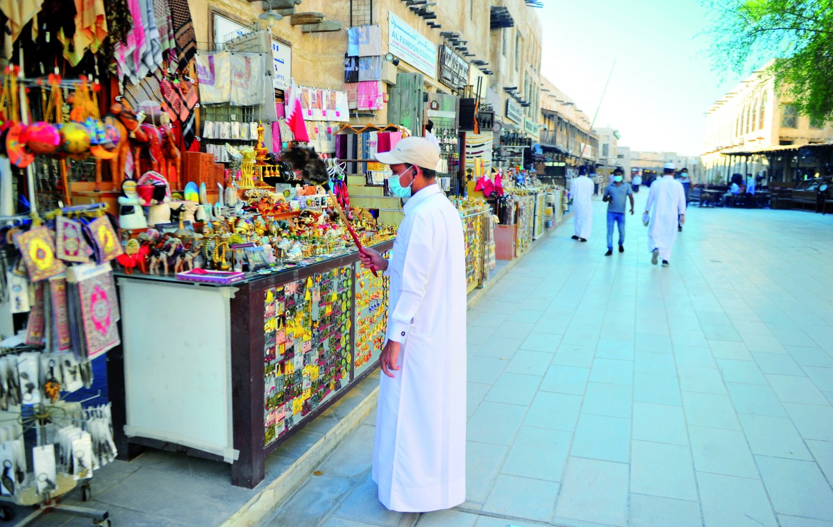 People visiting Souq Waqif as tourist destinations, malls and select restaurants reopened, yesterday. Pic: Abdul Basit / The Peninsula 