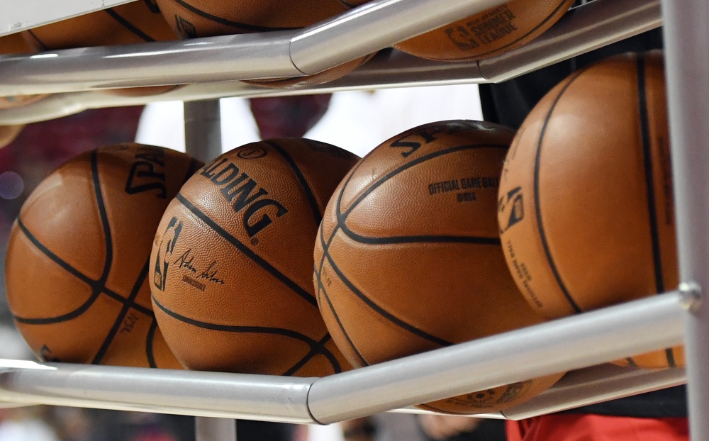 In this file photo taken on July 05, 2019 Basketballs are shown in a ball rack before a game between the Washington Wizards and the New Orleans Pelicans during the 2019 NBA Summer League at the Thomas & Mack Center on in Las Vegas, Nevada.  / AFP / GETTY 