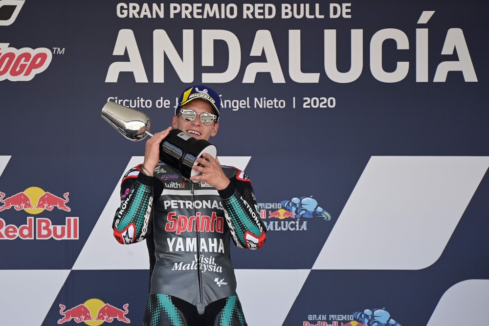 Petronas Yamaha SRT's French rider Fabio Quartararo celebrates on the podium after winning the MotoGP race during the Andalucia Grand Prix at the Jerez race track in Jerez de la Frontera on July 26, 2020. / AFP / JAVIER SORIANO