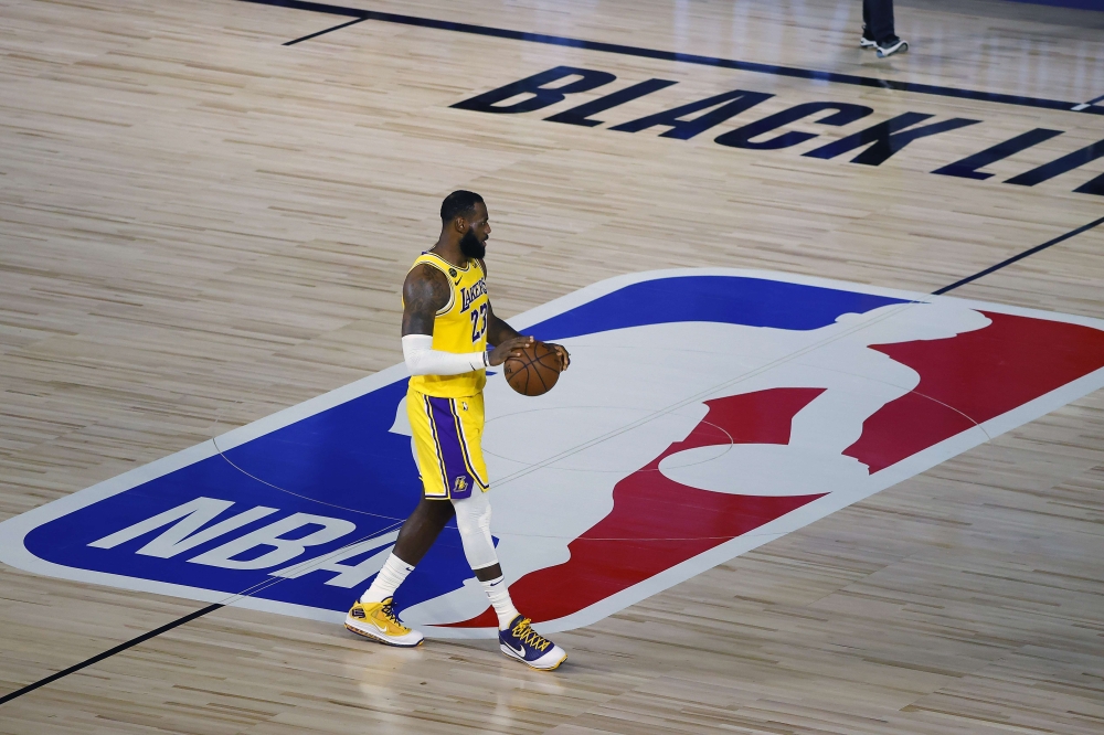 LAKE BUENA VISTA, FLORIDA - AUGUST 05: LeBron James #23 of the Los Angeles Lakers handles the ball on offense against the Oklahoma City Thunder during the third quarter at HP Field House at ESPN Wide World Of Sports Complex on August 05, 2020 in Lake Buen