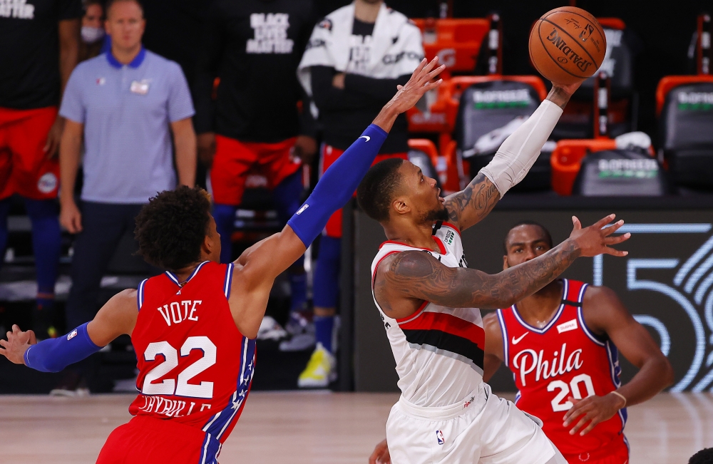 Damian Lillard #0 of the Portland Trail Blazers goers up for a shot against Matisse Thybulle #22 of the Philadelphia 76ers during the fourth quarter at Visa Athletic Center at ESPN Wide World Of Sports Complex on August 09, 2020 in Lake Buena Vista, Flori