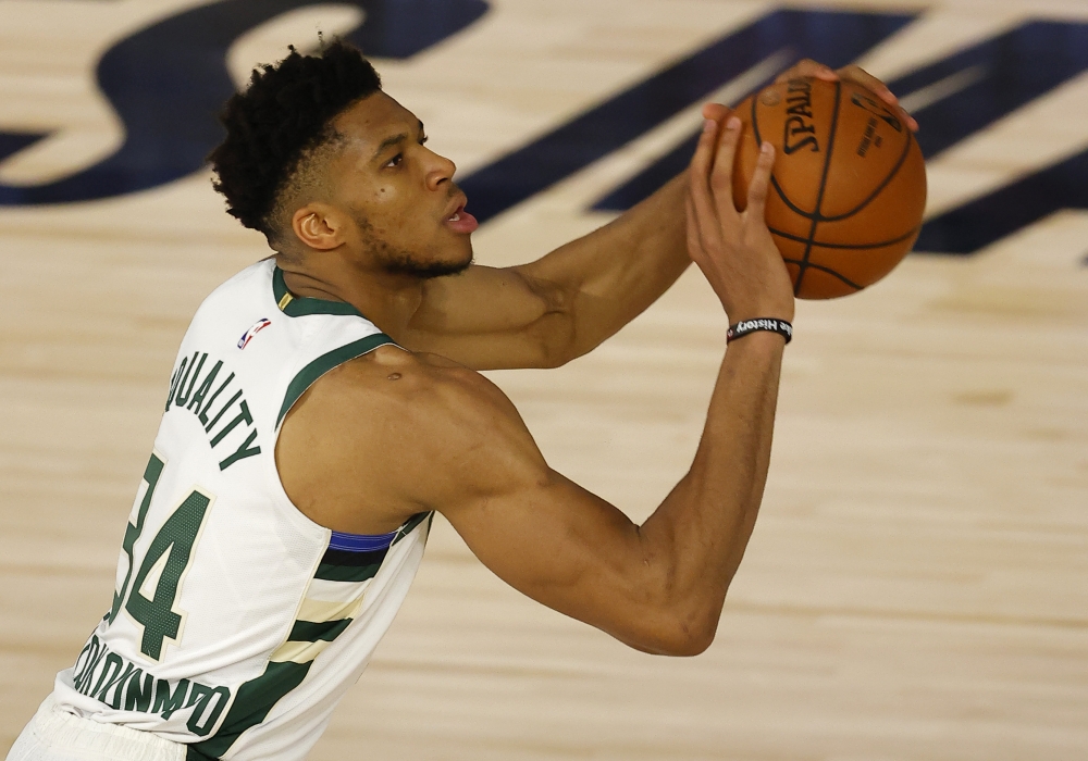 Giannis Antetokounmpo #34 of the Milwaukee Bucks shoots against the Orlando Magic in Game Three of the Eastern Conference First Round during the 2020 NBA Playoffs at The Field House at ESPN Wide World Of Sports Complex on August 22, 2020 in Lake Buena Vis