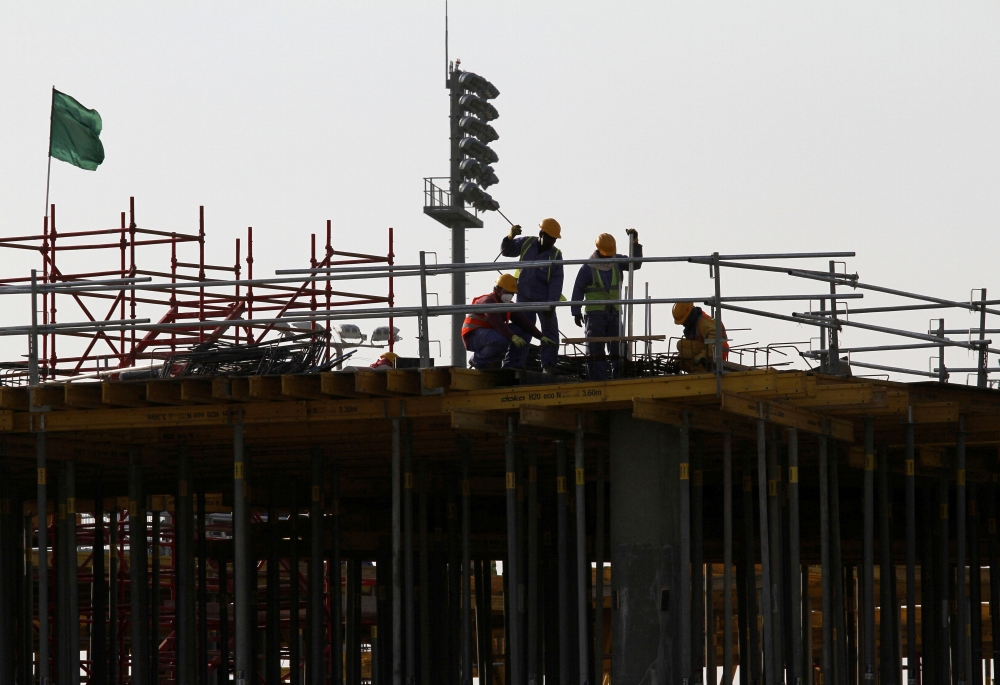 Labourers work at a construction site at the Aspire Zone in Doha, Qatar. (Reuters/Naseem Zeitoon/File Photo)