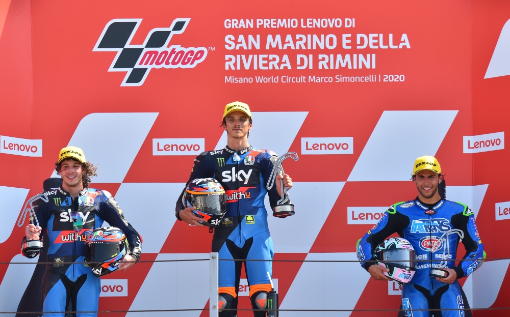 SKY Racing Team VR46's Luca Marini celebrates on the podium after winning the Moto2 race with second placed SKY Racing Team VR46's Marco Bezzecchi and third placed Italtrans Racing Team's Enea Bastianini REUTERS/Massimo Pinca