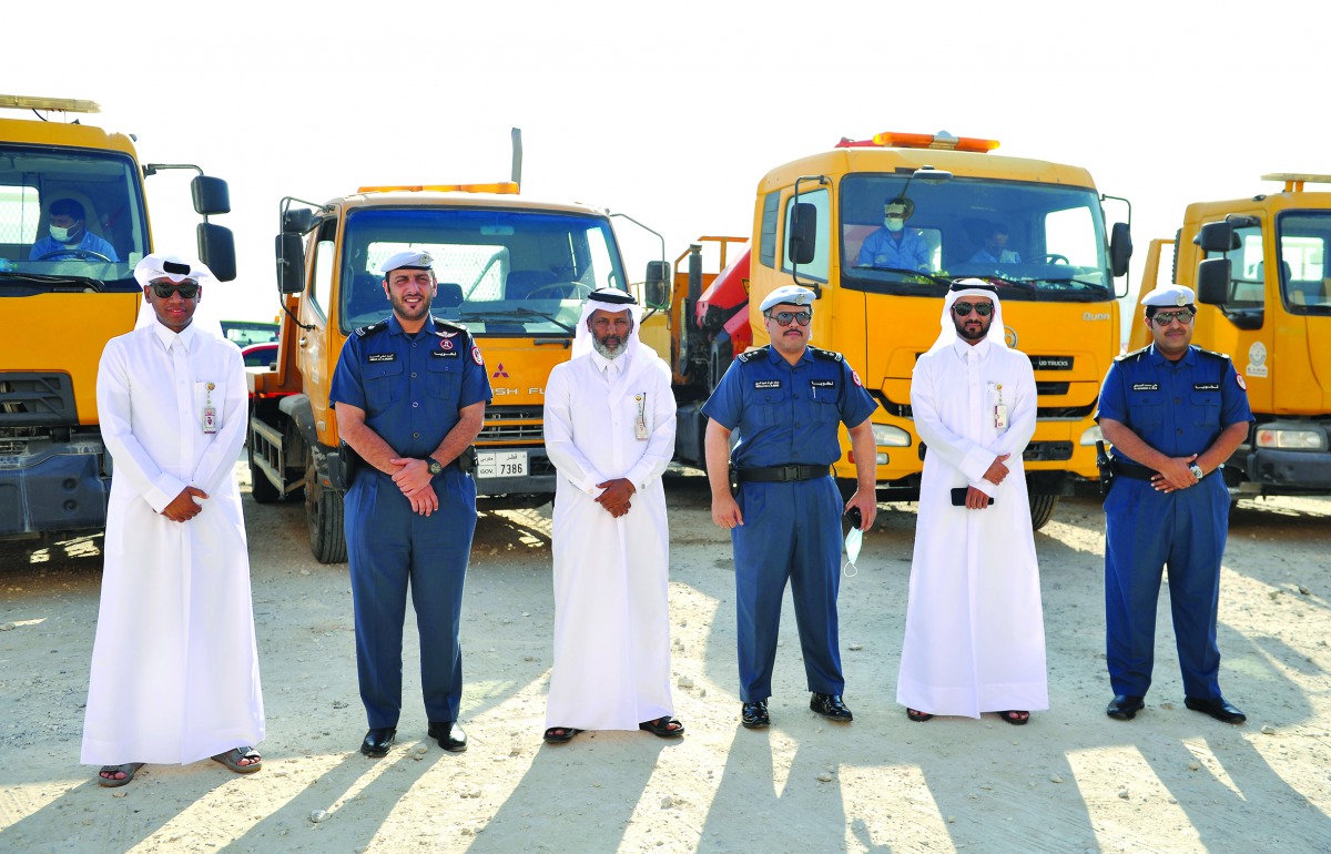 The members of the Joint Committee for Removing Abandoned Vehicles during the campaign which began yesterday in Al Wakra. Pic: Salim Matramkot/The Peninsula