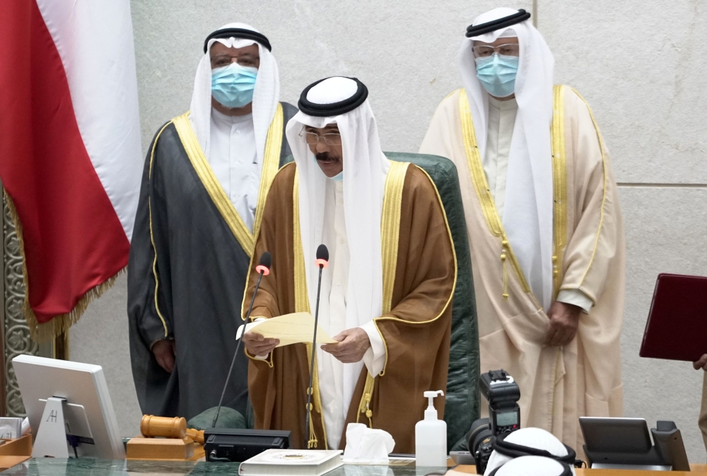 Kuwait Emir H H Sheikh Nawaf al-Ahmad al-Sabah holds a paper as he takes the oath of office at the parliament, in Kuwait City, Kuwait September 30, 2020. REUTERS/Stephanie McGehee