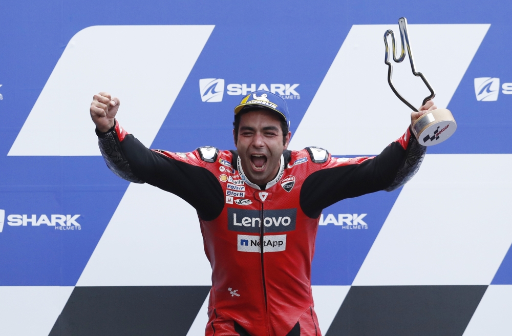 October 11, 2020 Mission Winnow Ducati Corse's Danilo Petrucci celebrates winning the race with the trophy on the podium REUTERS/Stephane Mahe