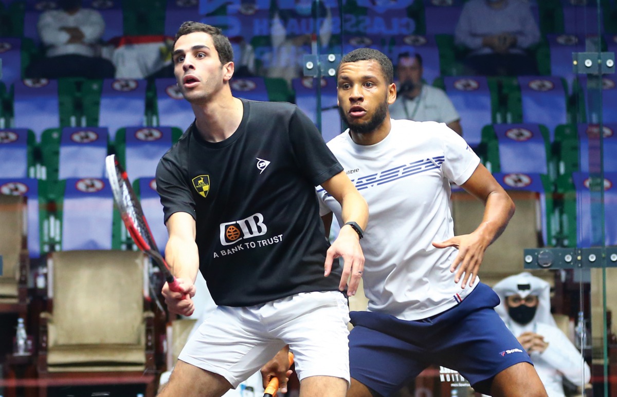 World No.1 Ali Farag (foreground) in action against England’s Richie Fallows during their second round match, yesterday. 