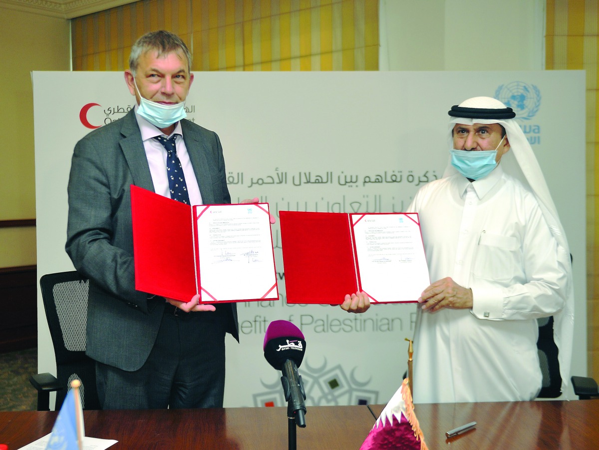 Ali bin Hassan Al Hammadi (right), Secretary General of QRCS with Philippe Lazzarini, Commissioner General of the UNRWA during the MoU signing ceremony at QRCS headquarters, yesterday.
PIC: ABDUL BASIT/ THE PENINSULA