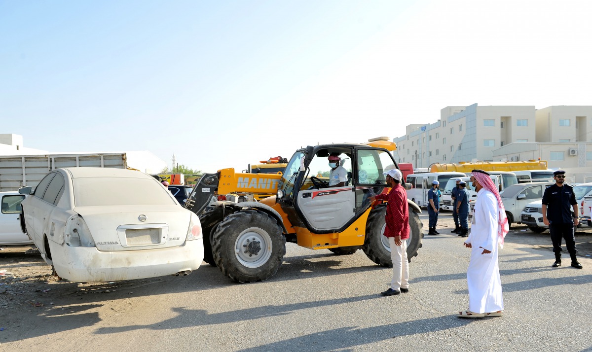 Abandoned vehicles being removed from the Industrial Area.  Pic: Salim Matramkot/The Peninsula