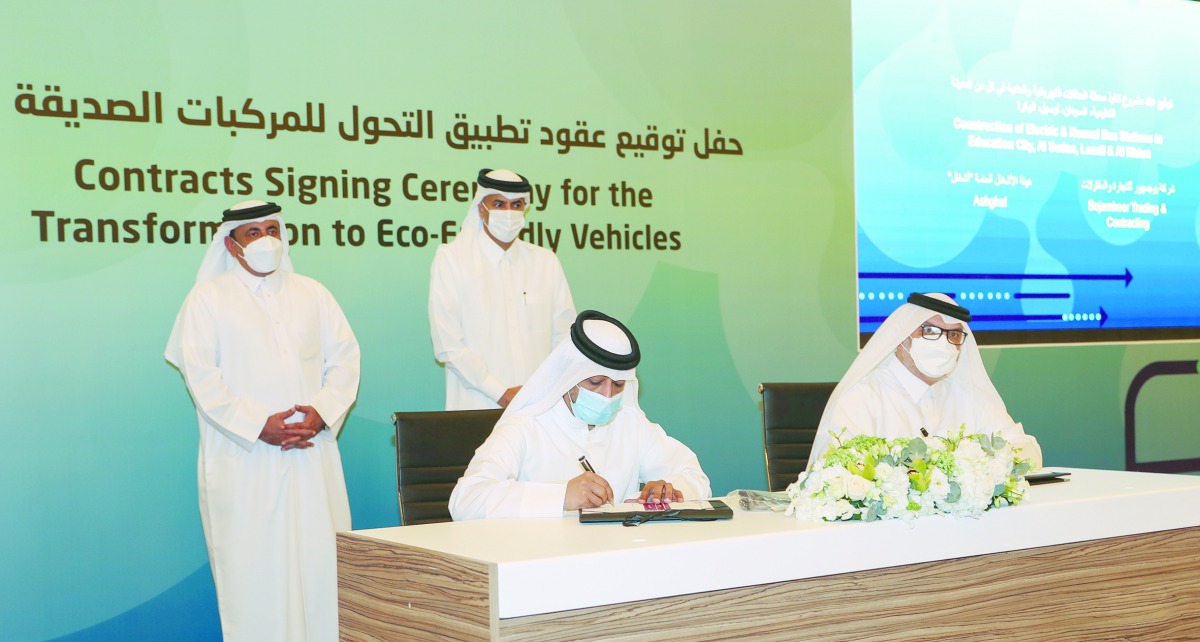 Prime Minister and Minister of Interior H E Sheikh Khalid bin Khalifa bin Abdulaziz Al Thani witnessing the signing of contracts to implement the transformation to environmentally-friendly vehicles. Also seen is the Minister of Transport and Communication