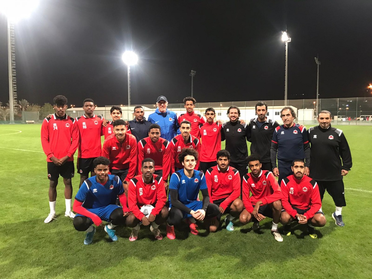 Blanc poses for a group photo with Al Rayyan's U-23 team. 