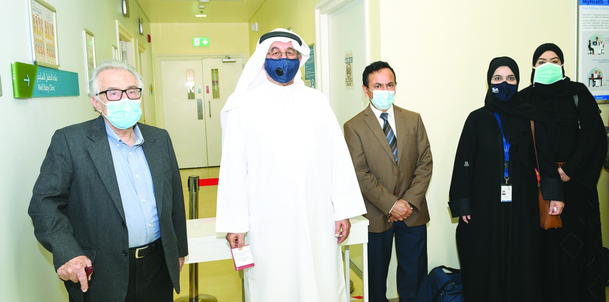 Dr Abdullah Al Kubaisi (second left), the first person to receive the Pfizer-BioNTech COVID-19 vaccine in Qatar, and Mohammed Frazat (left), the first expatriate to receive the vaccine, with Dr. Abdullatif Al Khal and other officials at the Al Wajbah Heal