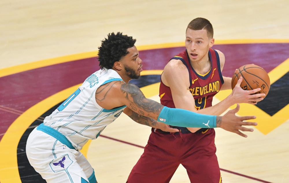 Miles Bridges #0 of the Charlotte Hornets guards Dylan Windler #9 of the Cleveland Cavaliers during the first quarter at Rocket Mortgage Fieldhouse on December 23, 2020 in Cleveland, Ohio. Jason Miller/Getty Images/AFP
