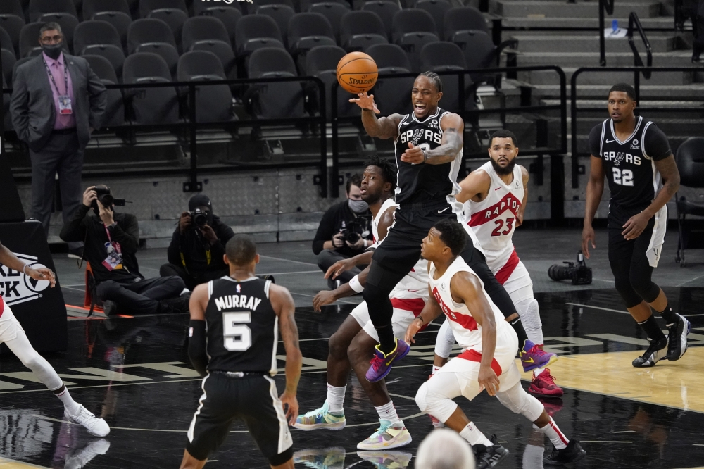 San Antonio Spurs guard DeMar DeRozan (10) passes the ball in the fourth quarter of the game against the Toronto Raptors at AT&T Center. Mandatory Credit: Scott Wachter-USA TODAY Sports