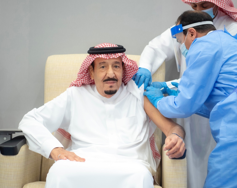 Saudi King gets a dose of a coronavirus disease vaccine in Neom, Saudi Arabia, January 8, 2021. Bandar Algaloud/Courtesy of Saudi Royal Court/Handout via Reuters 