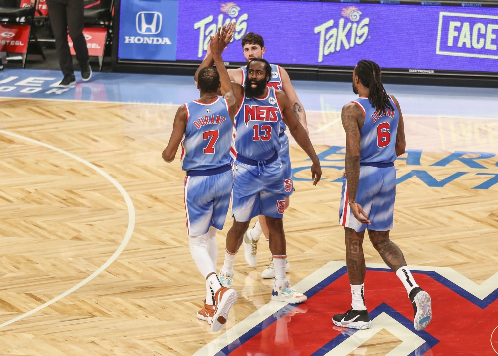 Brooklyn Nets guard James Harden (13) high fives forward Kevin Durant (7) during a time out in the second quarter against the Orlando Magic at Barclays Center. Mandatory Credit: Wendell Cruz-USA TODAY Sports