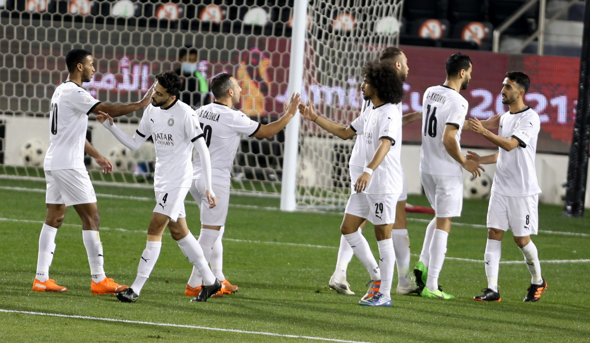 Al Sadd's players celebrate their 7-0 win over Muaither in the Amir Cup pre-quarter-final match yesterday. Picture: Hussein Sayed